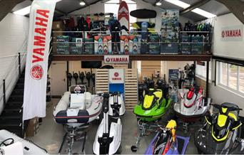 The Boat shop showroom full of jet skis and other water equipment