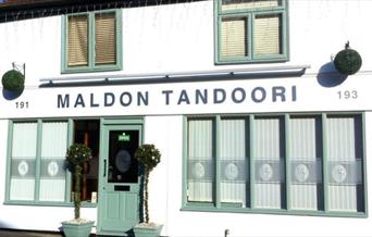 Outside view of Maldon Tandoori Restaurant with pretty green painted doors and windows