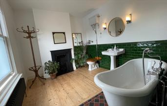 Luxurious bathroom with freestanding tub and plants