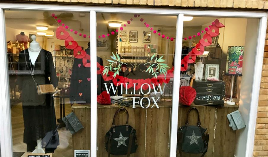 Willow and Fox showroom window with womens clothes and handbags