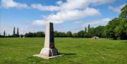 The stone memorial is a simple white obelisk on the playing fields