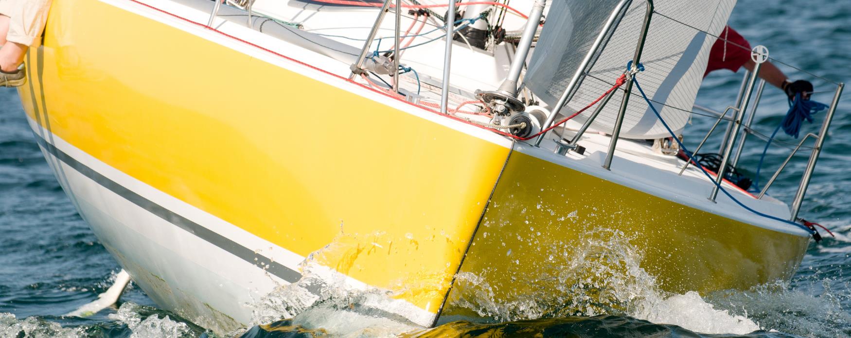 A sailing boat cruising through the waves
