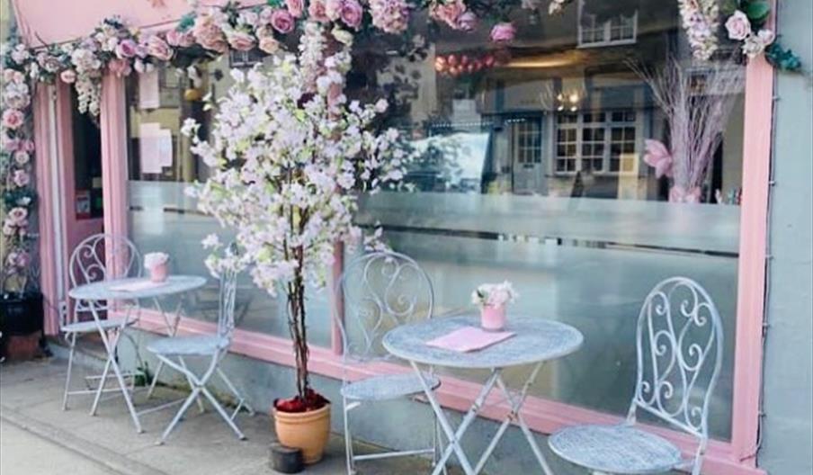 Outside of The Waffle Bar with pink flowers