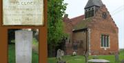 Memorial Clock and inscription and Commonwealth War Grave at St Michael's Church, Woodham Walter