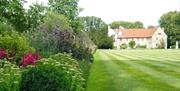 The gardens and lawn looking towards Beeleigh Abbey, by Tom McGahan
