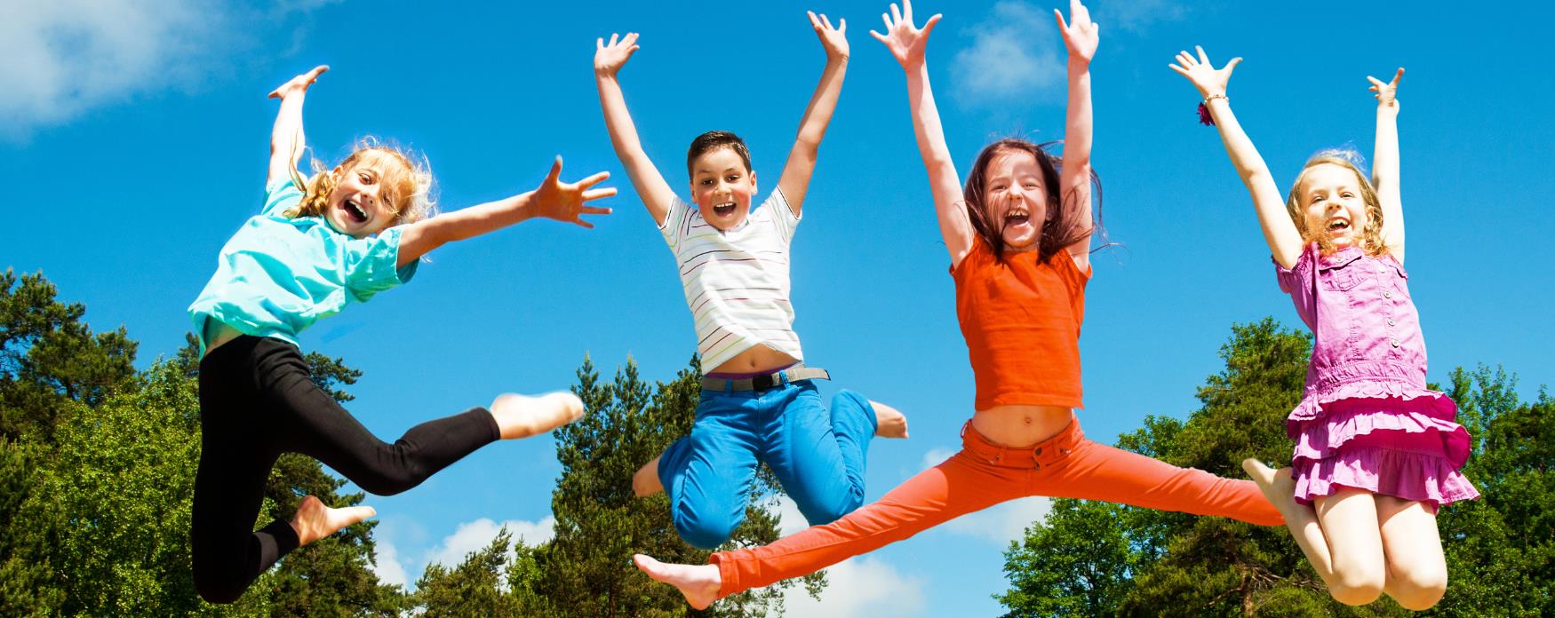 Happy kids jumping in air