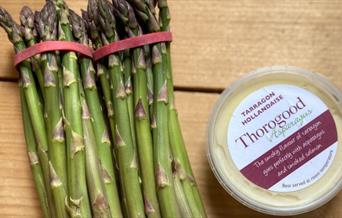 Bunches of fresh asparagus and tub of Tarragon sauce from Thorogood Asparagus