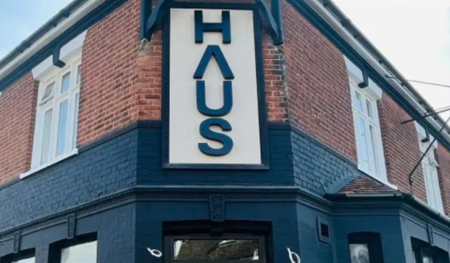 Exterior of HAUS with black and white sign