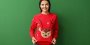 Woman wearing Christmas jumper with reindeer on