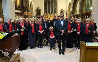 Maldon Choral Society singers, dressed in red and black