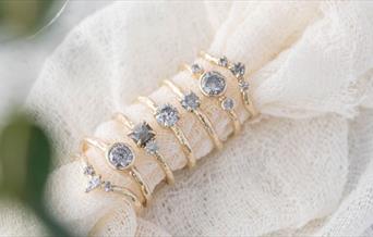 Selection of sparkling engagement rings from Anvil & Ivy