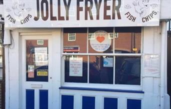 Outside of Jolly Fryer traditional fish and chip shop with blue and white paintwork