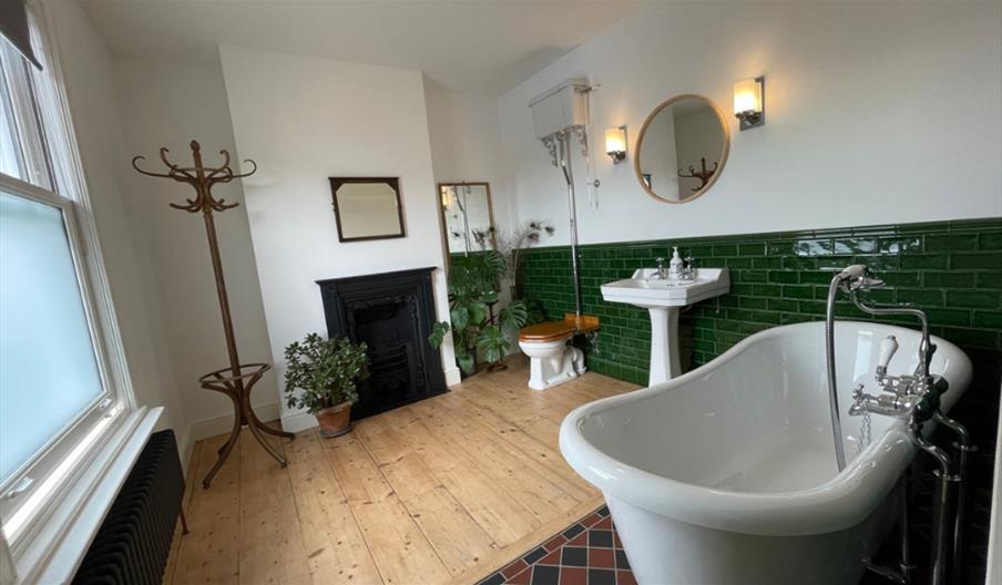 Luxurious bathroom with freestanding tub and plants