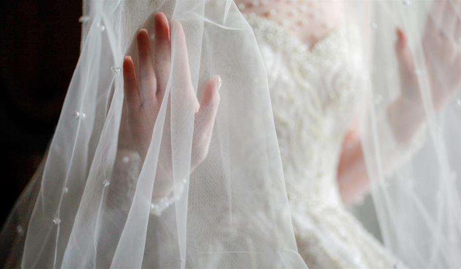 Close up of wedding dress and veil