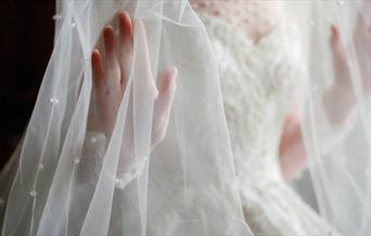 Close up of wedding dress and veil