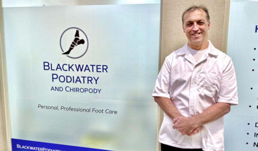 Chiropodist and podiatrist Nick Hazael in front of his clinic