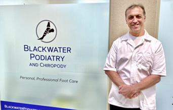 Chiropodist and podiatrist Nick Hazael in front of his clinic