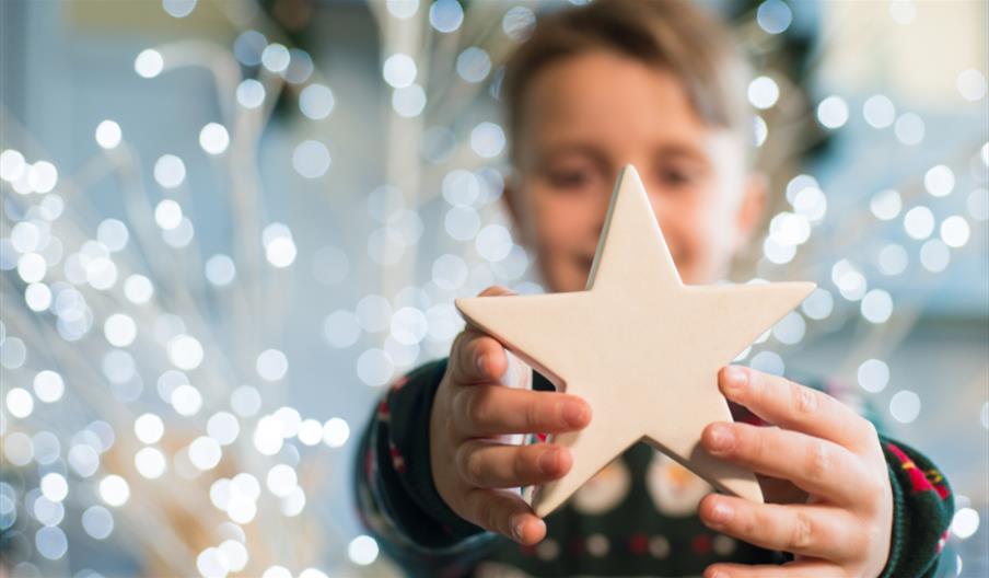 Child holding star