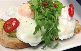 Avocado and poached eggs on toast at Forget Me Not Tearooms