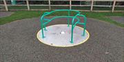 Wheelchair accessible roundabout at Great Braxted playground