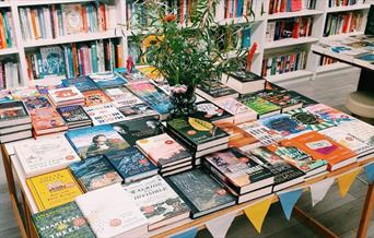 Table piled with exciting books at Maldon Books