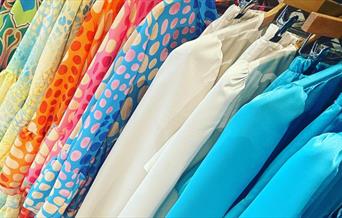 Rack of ladies' blouses in pretty pastel colours at No1 Boutique