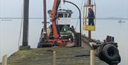 Floating Crane making repairs to Kings Wharf Jetty