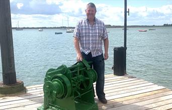 Ian Harvey with a newly restored maritime winch