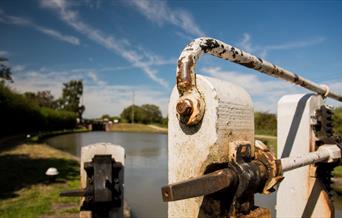 A close up of a canal lock and gates.