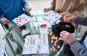 A group of people playing bingo.