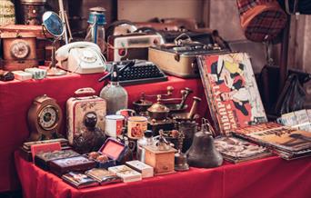 A stall with items for sale at a Flea Market