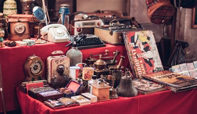 A stall with items for sale at a Flea Market