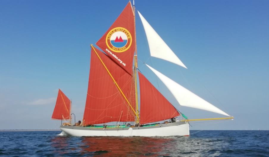 A thames barge of the Sea-Change Sailing Trust on the waves.