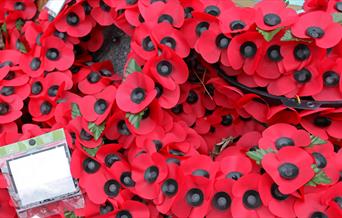Poppy wreaths on a war memorial