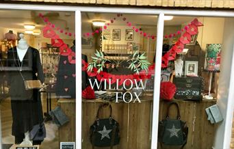 Willow and Fox showroom window with womens clothes and handbags