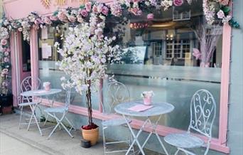 Outside of The Waffle Bar with pink flowers